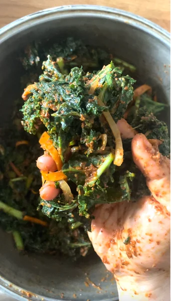 after mixing kimchi paste into kale